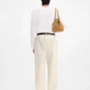 The Fernando de-Nîmes denim pants Crocodile-embossed jeans