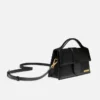 The large Bambino Handbag with adjustable crossbody strap The large Bambino Handbag with adjustable crossbody strap