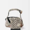 The low Duelo slingbacks Circle and square kitten heels The low Duelo slingbacks Circle and square kitten heels
