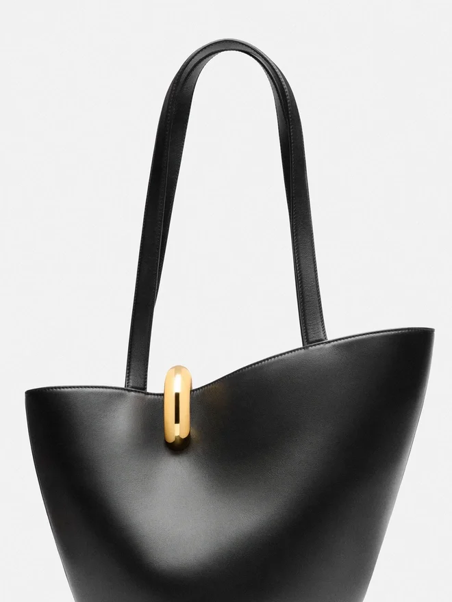 The medium Bambola Medium asymmetric bucket bag The medium Bambola Medium asymmetric bucket bag
