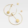 The Nodo hoops earrings Asymmetric hoop earrings