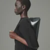 The Ovalo clutch Folded shoulder bag