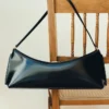 The Ovalo clutch Folded shoulder bag