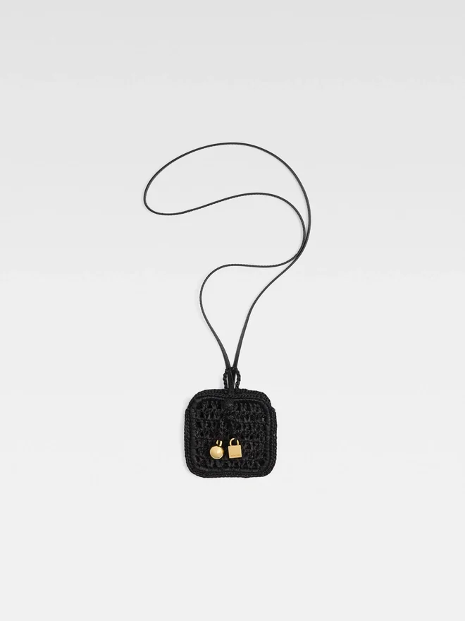 The Spiaggia wallet Raffia AirPods holder The Spiaggia wallet Raffia AirPods holder