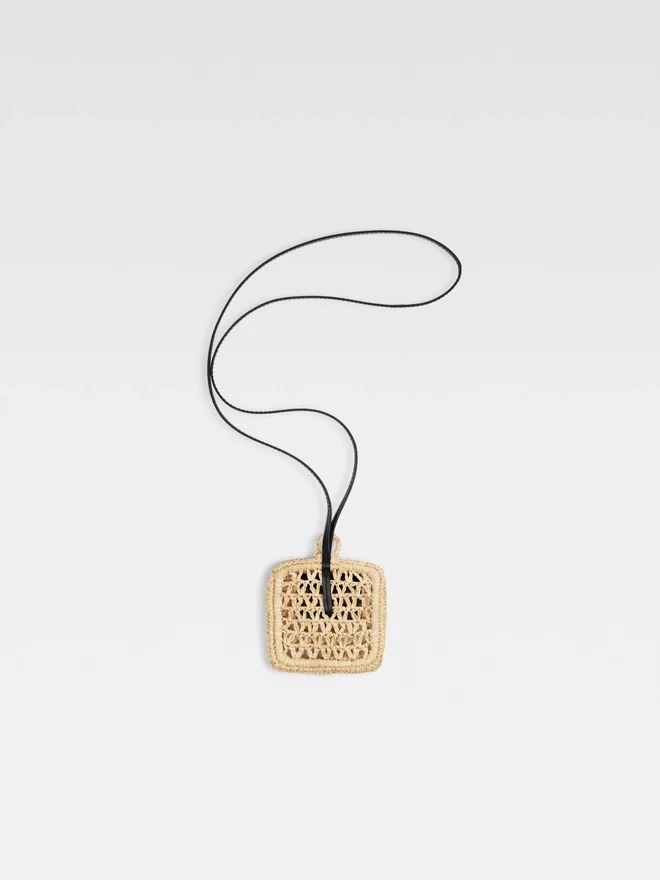 The Spiaggia wallet Raffia AirPods holder The Spiaggia wallet Raffia AirPods holder